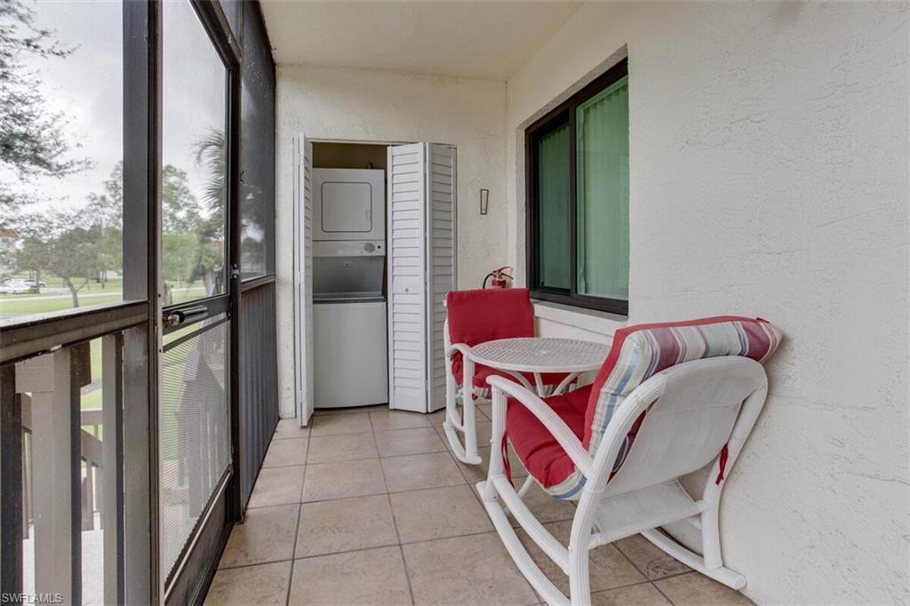 4351 27th Court Southwest, Unit 203 Naples, FL 34116 - Photo 10 of 34 Sunroom / solarium with stacked washer / drying machine