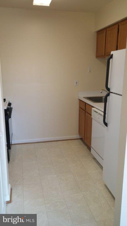 631 Waterloo Road, Unit 121 Warrenton, VA 20186 - Photo 2 of 5 a view of a refrigerator in a kitchen