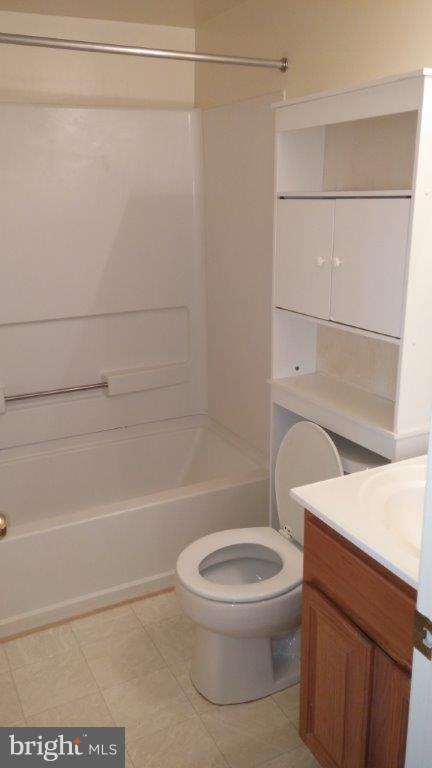 631 Waterloo Road, Unit 121 Warrenton, VA 20186 - Photo 4 of 5 a white toilet sitting next to a bath tub