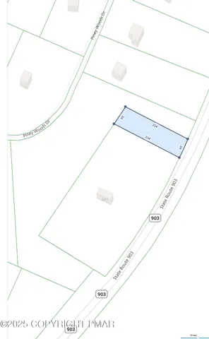 an aerial view of a houses with a yard