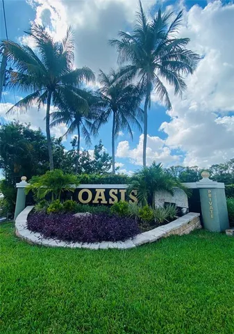 a view of a swimming pool with a table and chairs