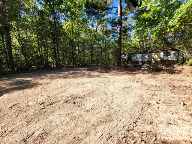 a view of empty space and a yard