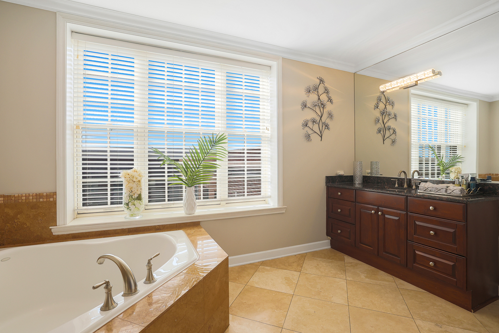 50 North Plum Grove Road, Unit 511E Palatine, IL 60067 - Photo 18 of 28 a spacious bathroom with a granite countertop tub and a sink