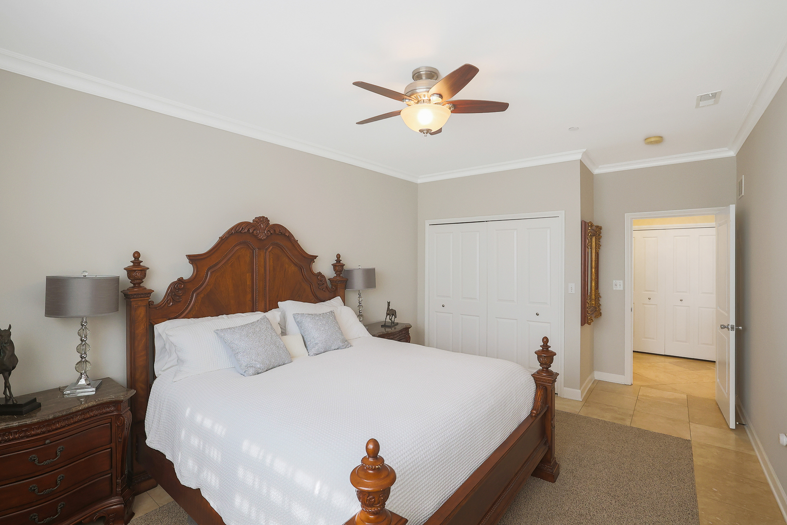 50 North Plum Grove Road, Unit 511E Palatine, IL 60067 - Photo 21 of 28 a bedroom with a bed and a chandelier