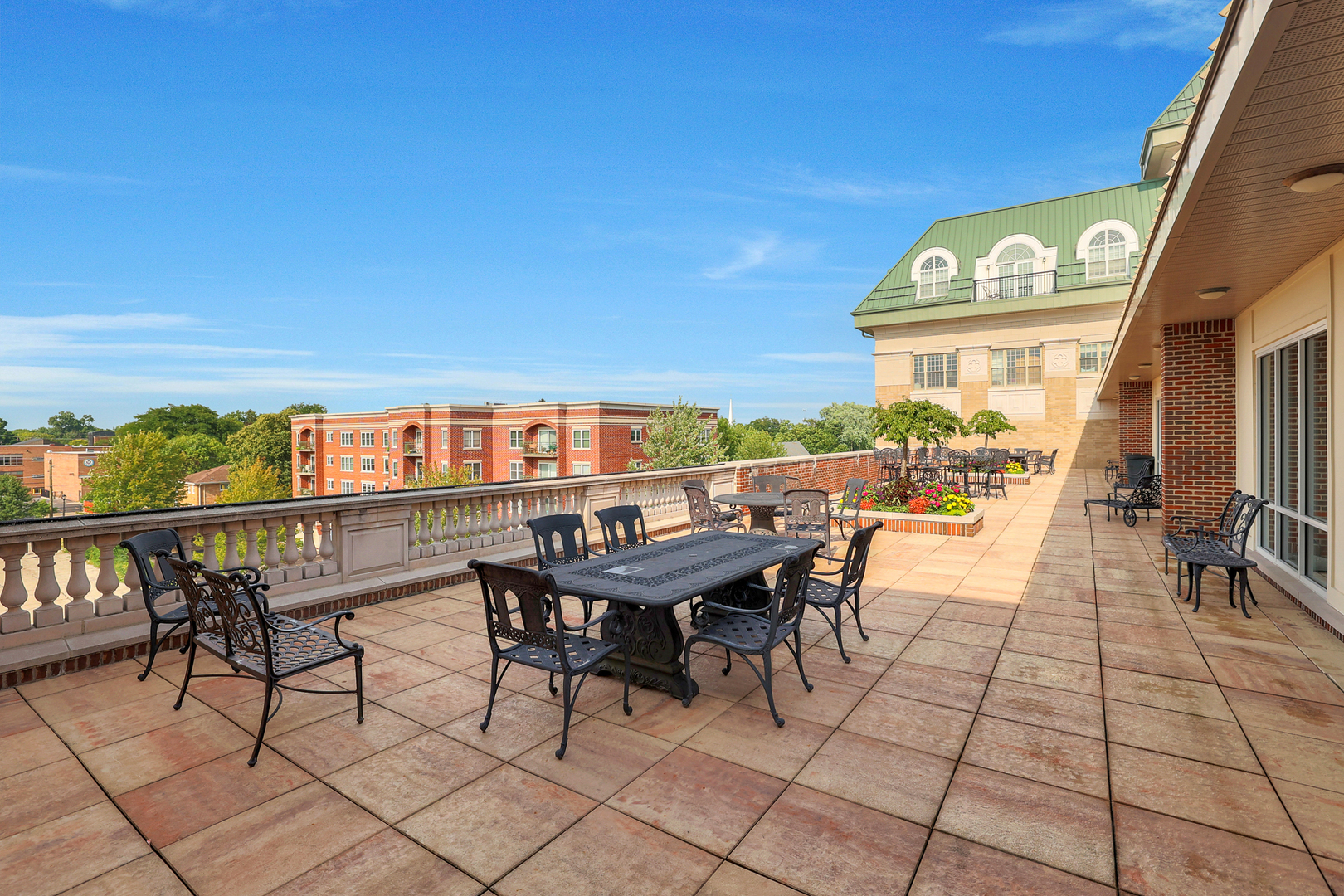 50 North Plum Grove Road, Unit 511E Palatine, IL 60067 - Photo 27 of 28 a view of a terrace with furniture and a potted plant