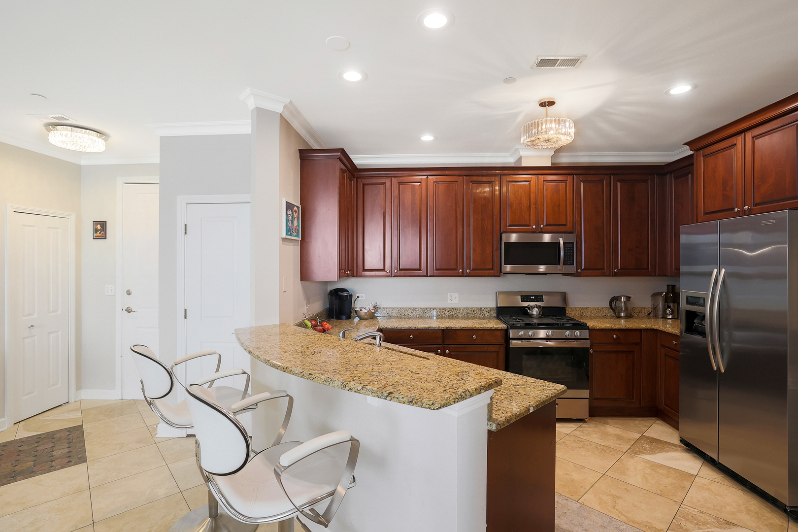 50 North Plum Grove Road, Unit 511E Palatine, IL 60067 - Photo 10 of 28 a kitchen that has a sink cabinets counter space and stainless steel appliances