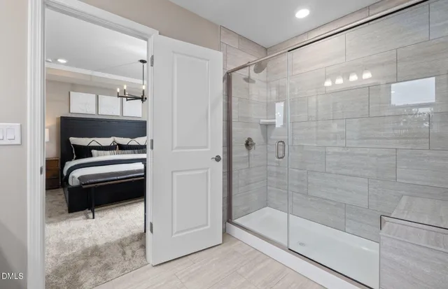 a bathroom with a shower and a sink