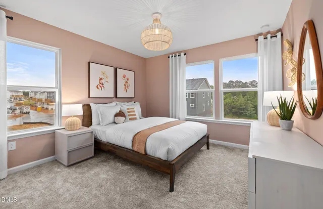 a spacious bedroom with a bed and a large window