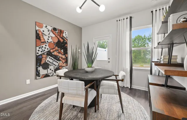 a view of a livingroom with furniture and a window