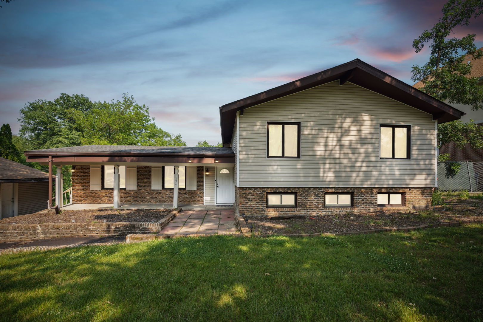 1741 Oak Lane Road Flossmoor, IL 60422 - Photo 1 of 30 a front view of a house with a yard