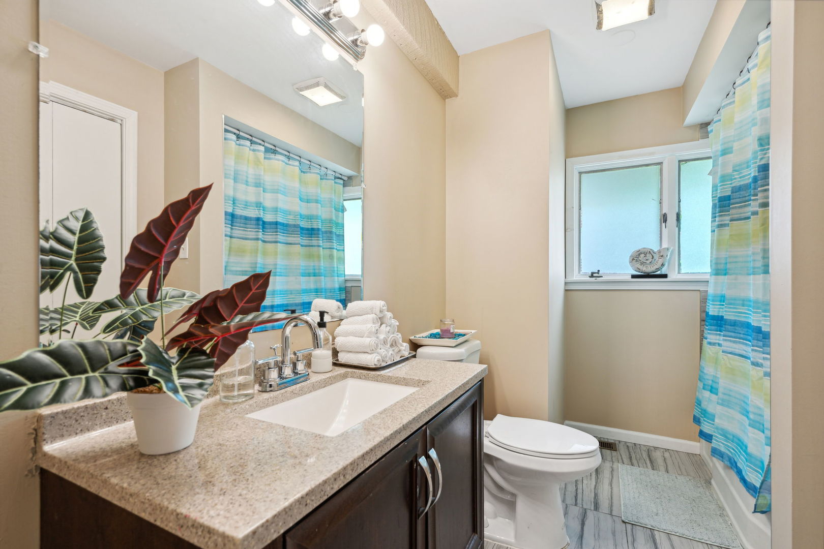 1741 Oak Lane Road Flossmoor, IL 60422 - Photo 20 of 30 a bathroom with a granite countertop sink a toilet and mirror