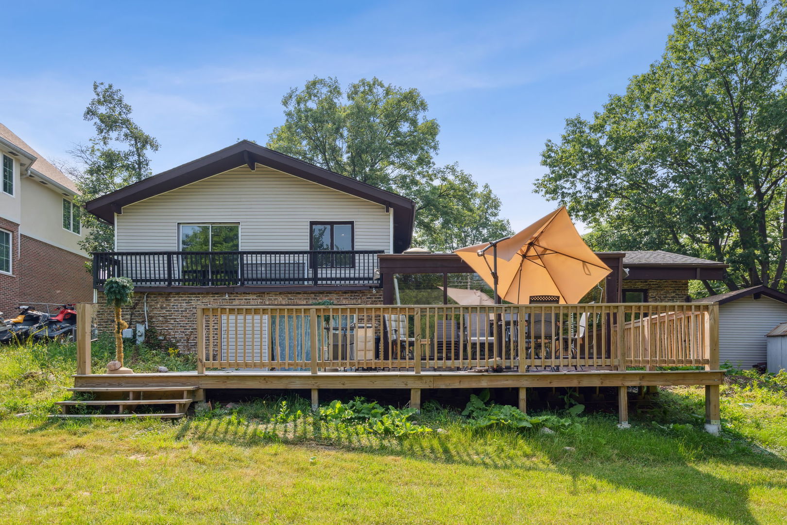 1741 Oak Lane Road Flossmoor, IL 60422 - Photo 24 of 30 a view of a house with wooden deck and furniture
