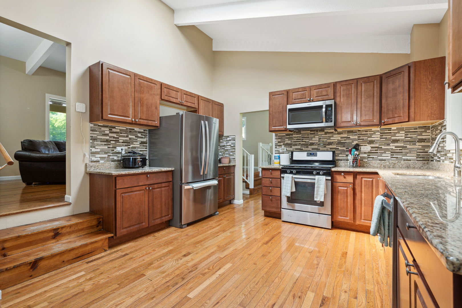 1741 Oak Lane Road Flossmoor, IL 60422 - Photo 5 of 30 a kitchen with stainless steel appliances wooden cabinets a stove top oven a sink and dishwasher