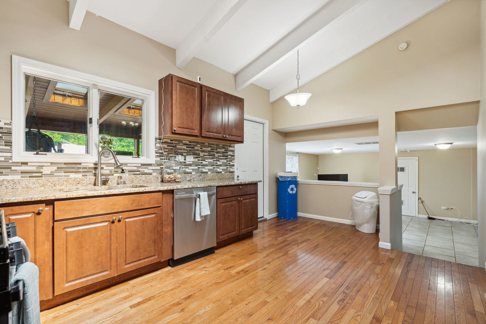 1741 Oak Lane Road Flossmoor, IL 60422 - Photo 6 of 30 a large kitchen with a wooden floor and cabinets