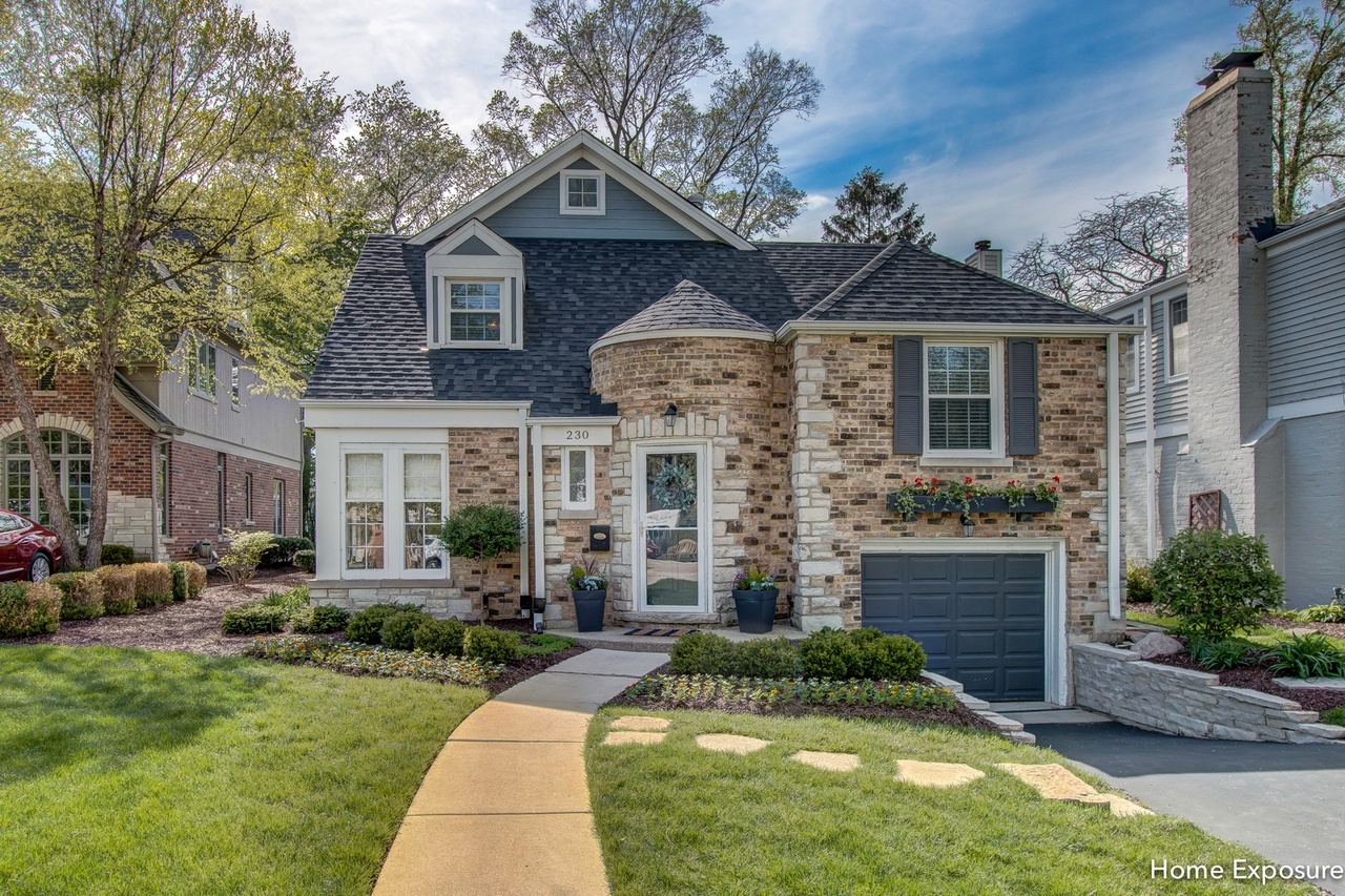 Undisclosed Address Clarendon Hills, IL 60514 - Photo 1 of 21 a front view of a house with a yard