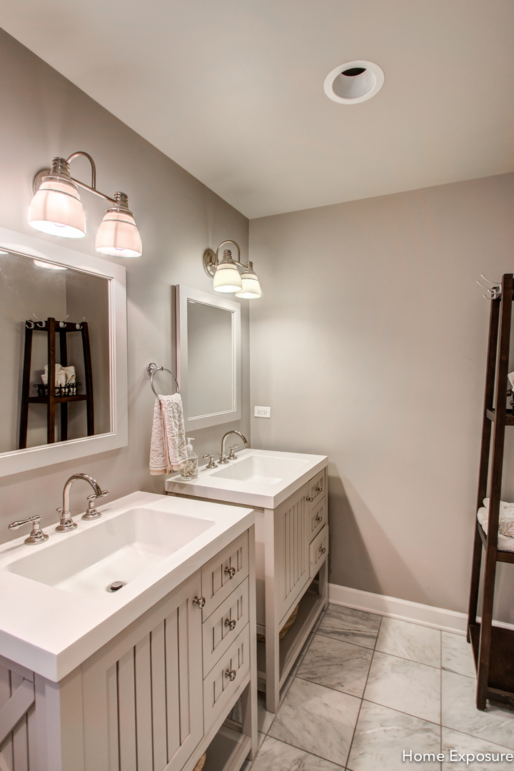 Undisclosed Address Clarendon Hills, IL 60514 - Photo 13 of 21 a bathroom with a sink and a mirror
