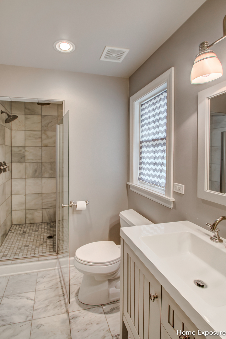 Undisclosed Address Clarendon Hills, IL 60514 - Photo 14 of 21 a bathroom with a sink a toilet and shower