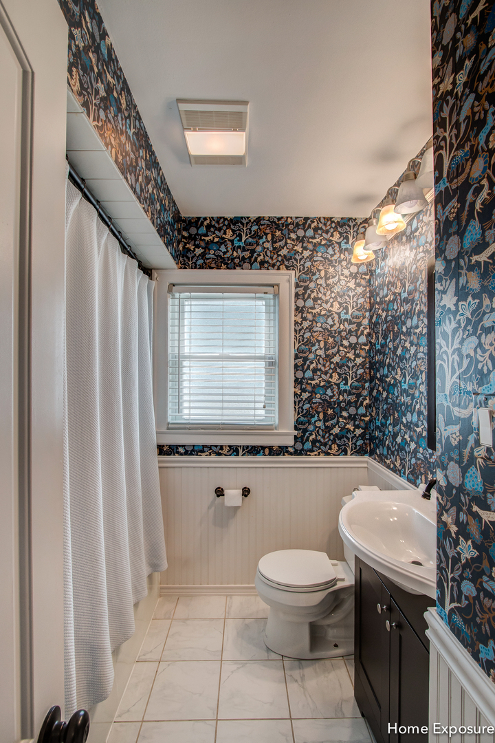 Undisclosed Address Clarendon Hills, IL 60514 - Photo 17 of 21 a bathroom with a granite countertop toilet a sink and a mirror
