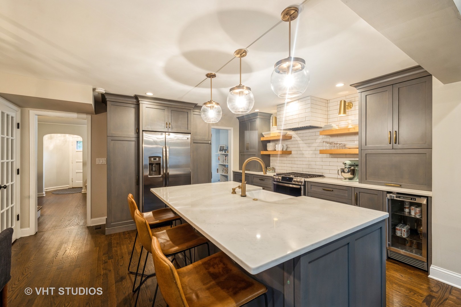 Undisclosed Address Clarendon Hills, IL 60514 - Photo 6 of 21 a kitchen with stainless steel appliances kitchen island granite countertop a refrigerator a sink dishwasher and white cabinets with wooden floor