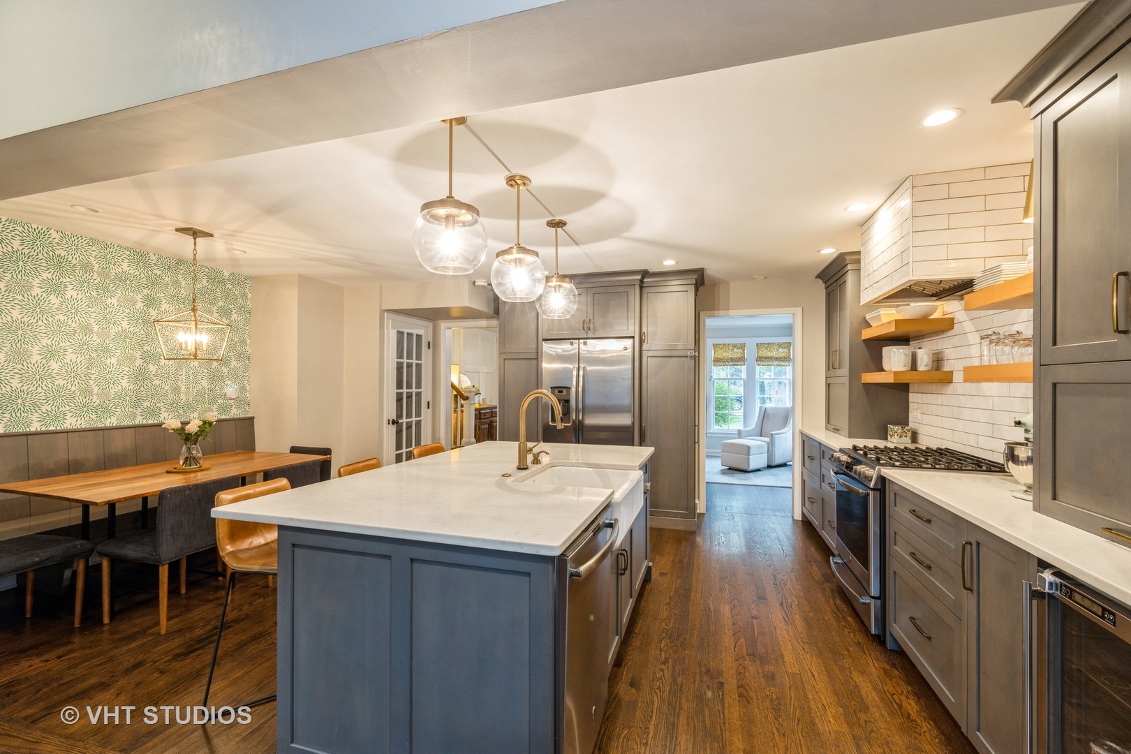 Undisclosed Address Clarendon Hills, IL 60514 - Photo 7 of 21 a large kitchen with kitchen island a large counter space a sink appliances and dining table