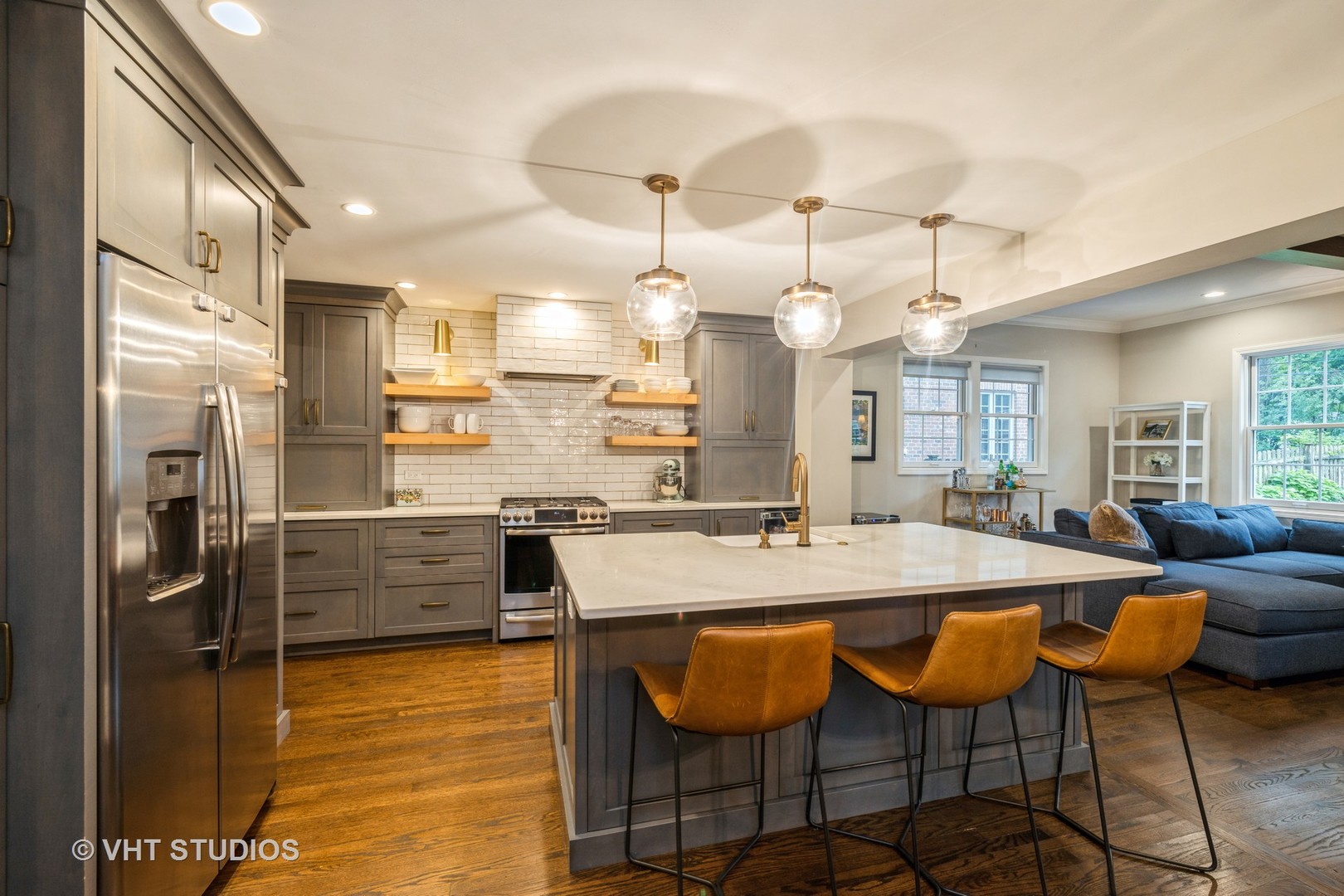 Undisclosed Address Clarendon Hills, IL 60514 - Photo 9 of 21 a large kitchen with granite countertop a stove a sink a dining table and chairs