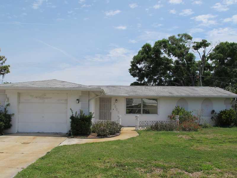 2655 Valencia Road Venice, FL 34293 - Photo 1 of 1 a front view of a house with garden