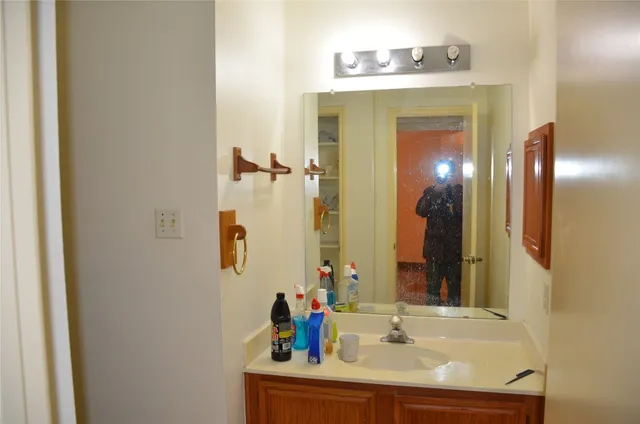 a bathroom with a sink and a mirror