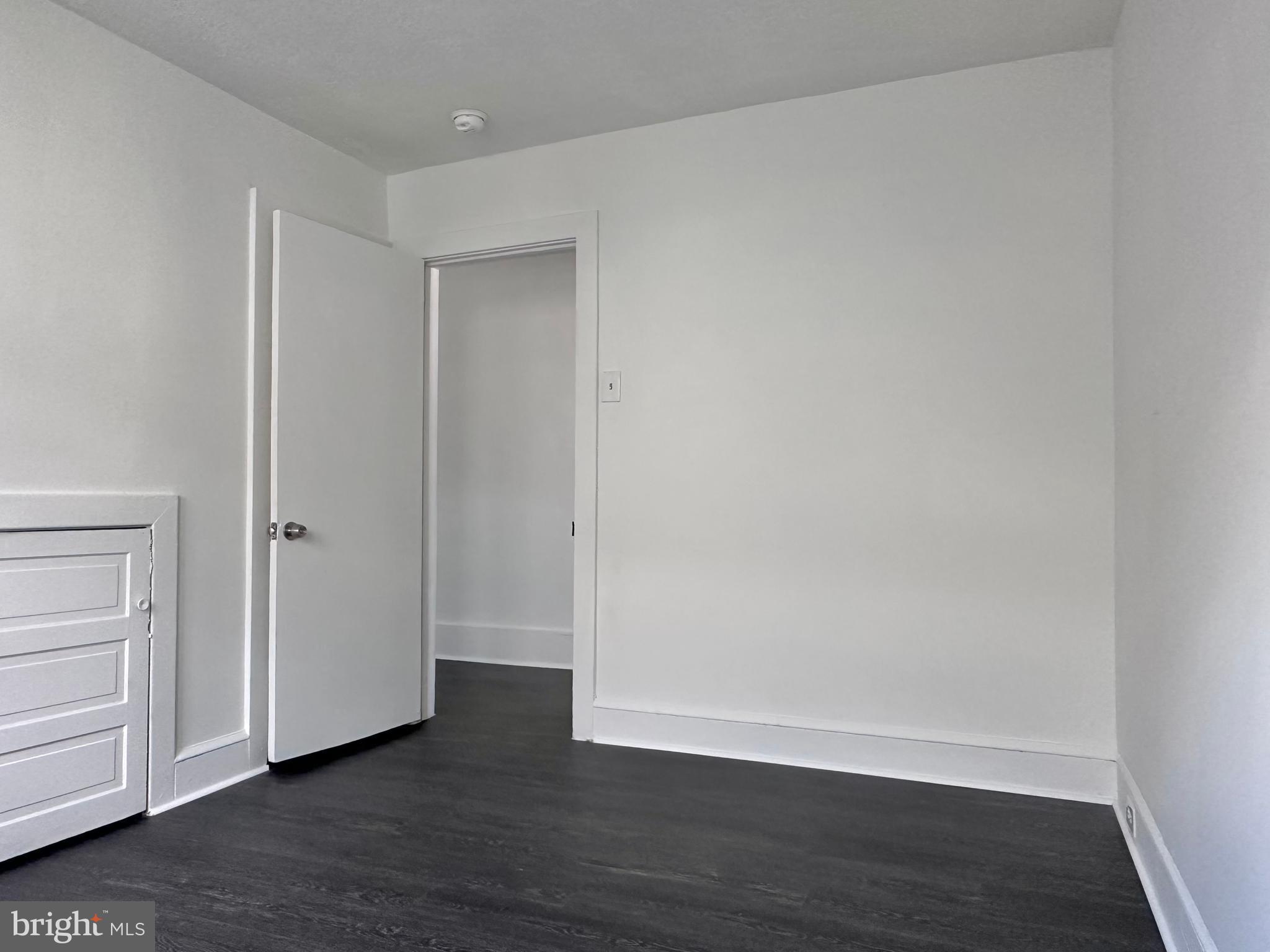 411 Burmont Road Drexel Hill, PA 19026 - Photo 21 of 28 a view of an empty room with closet and wooden floor