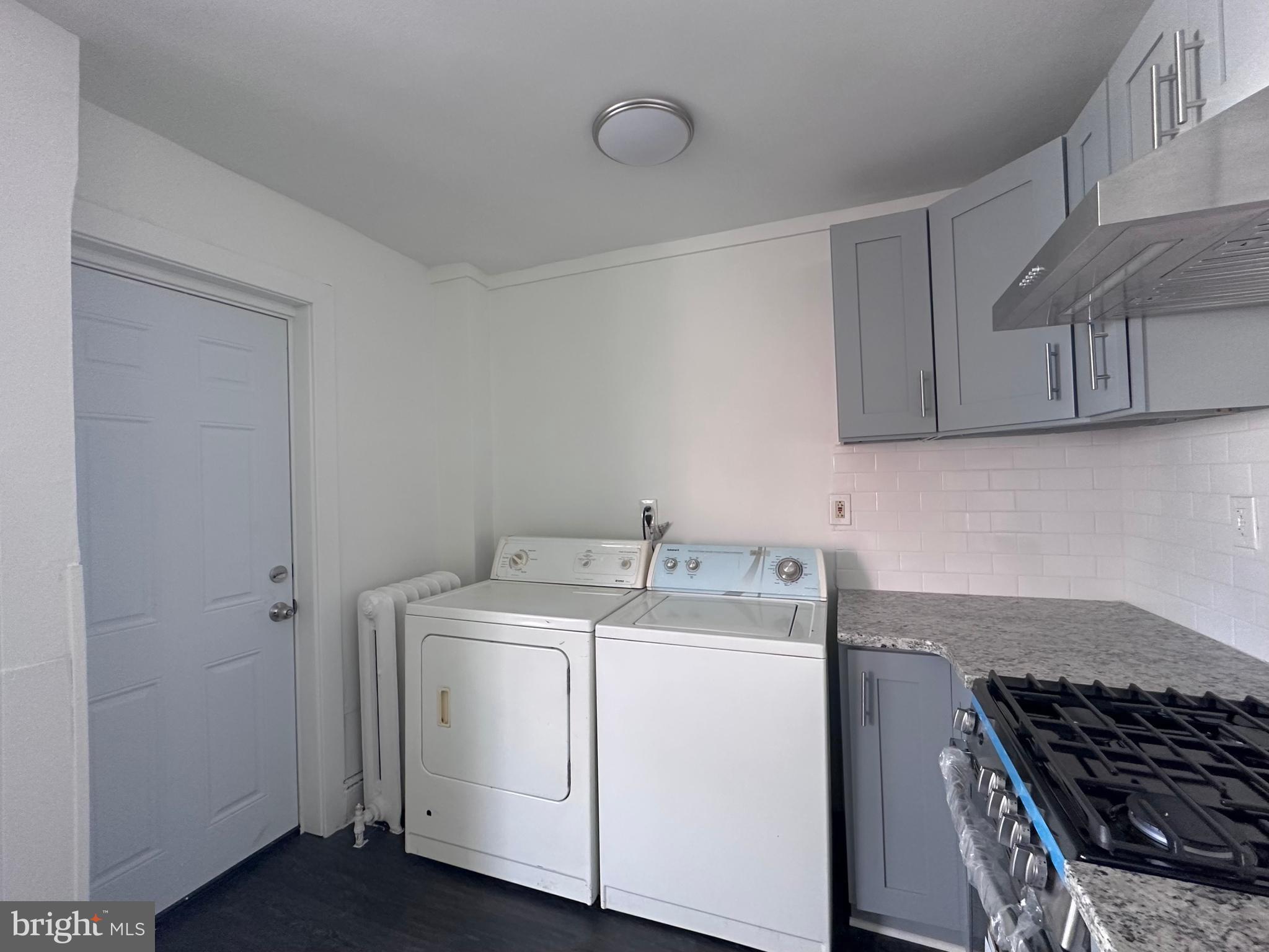 411 Burmont Road Drexel Hill, PA 19026 - Photo 26 of 28 a kitchen with a stove and white cabinets
