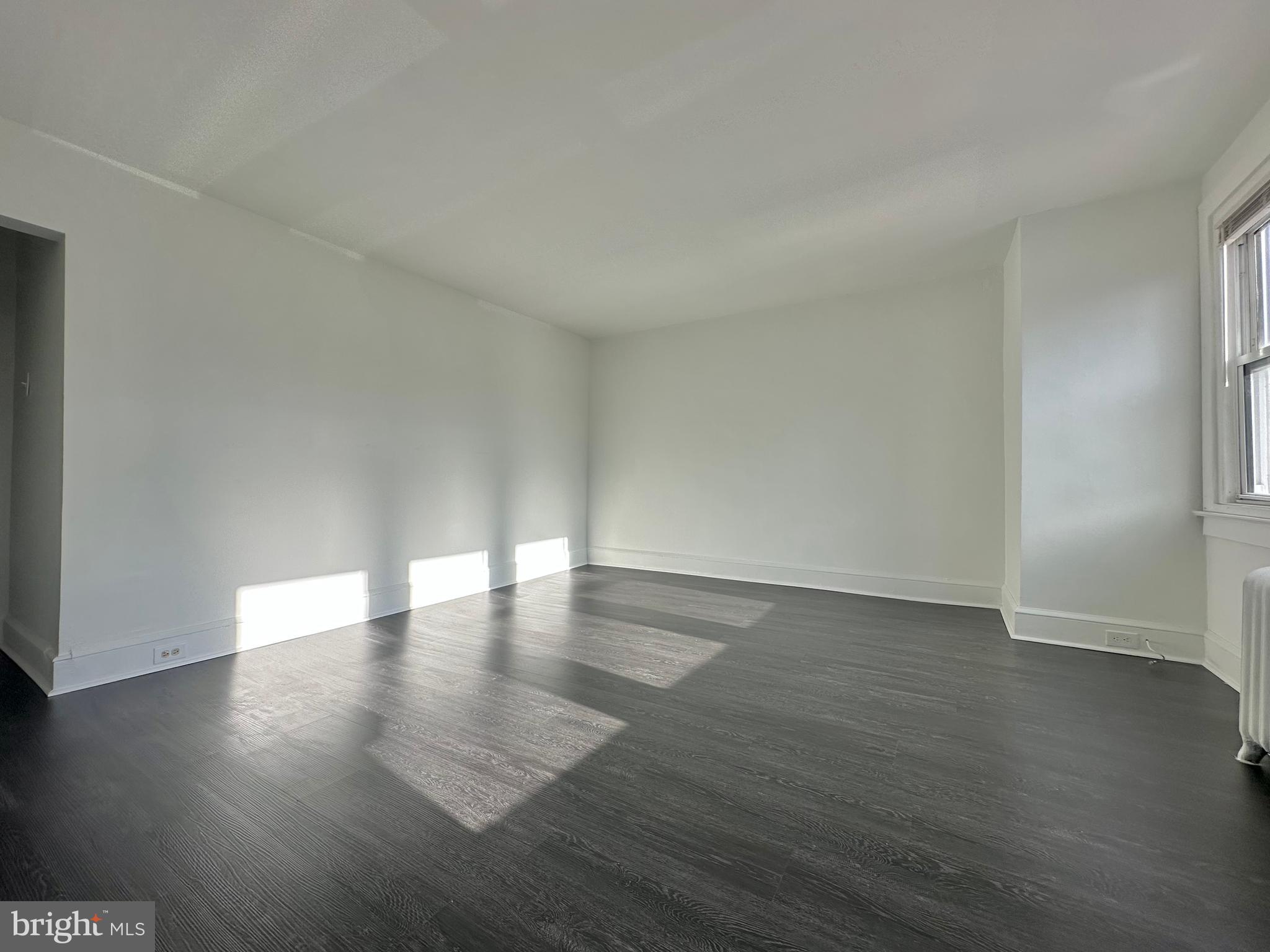 411 Burmont Road Drexel Hill, PA 19026 - Photo 9 of 28 a view of an empty room and wooden floor