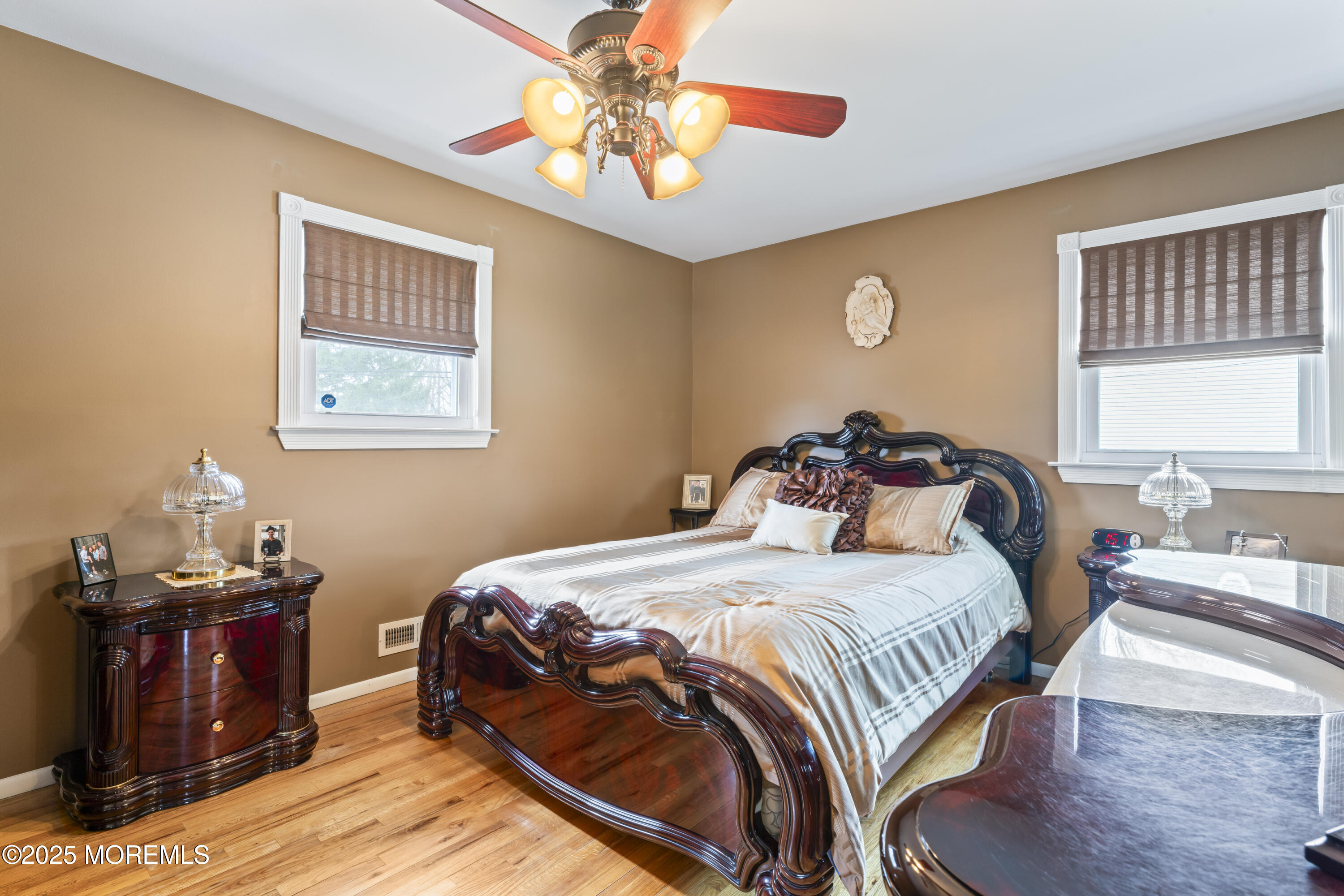 12 Nottingham Drive Howell, NJ 07731 - Photo 13 of 34 a bedroom with a bed and wooden floor