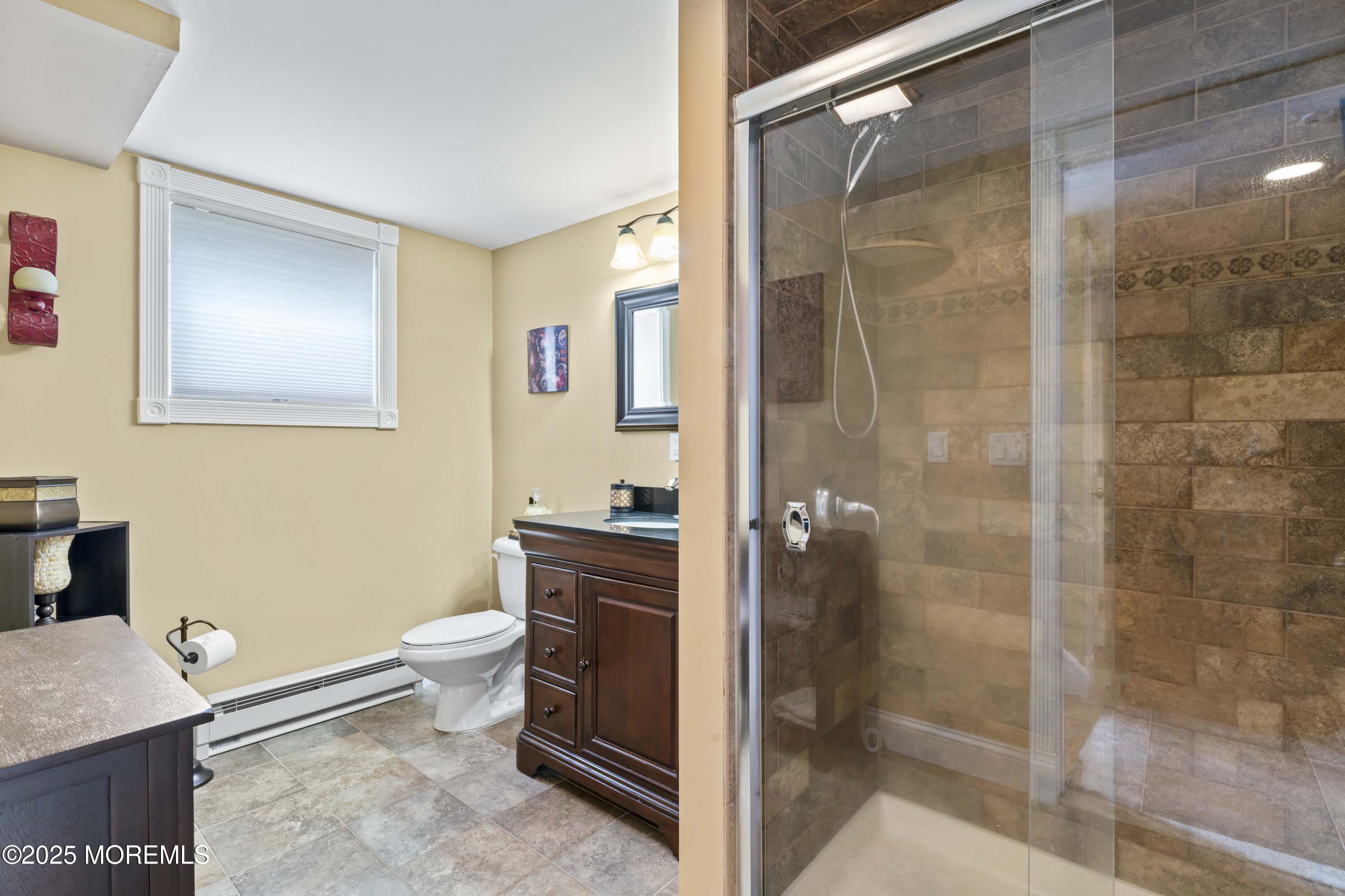 12 Nottingham Drive Howell, NJ 07731 - Photo 17 of 34 a bathroom with a granite countertop sink toilet and shower