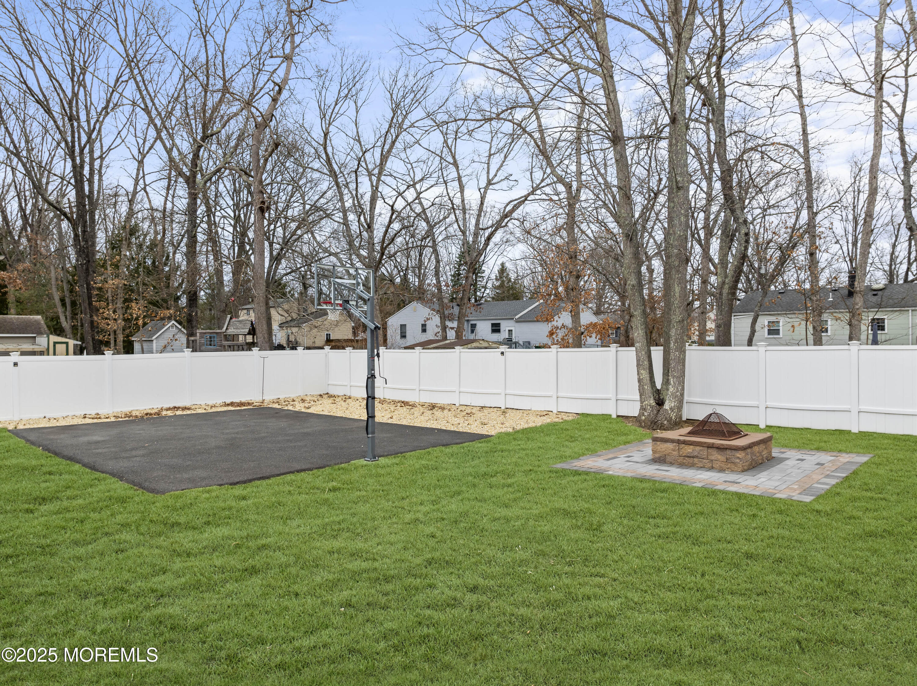 12 Nottingham Drive Howell, NJ 07731 - Photo 27 of 34 a swimming pool with lots of tress in the background