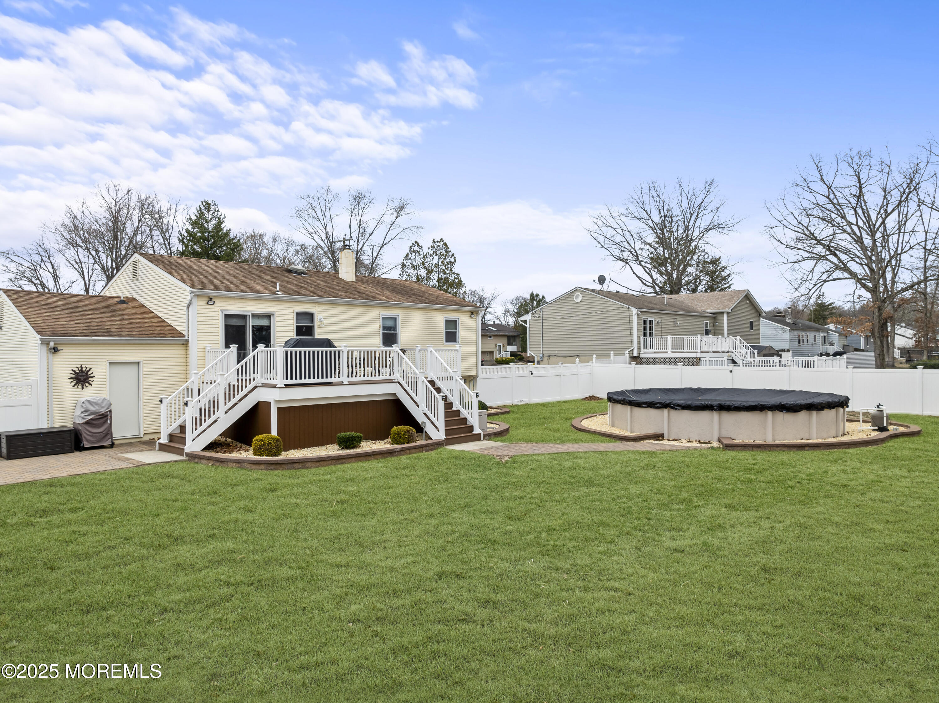 12 Nottingham Drive Howell, NJ 07731 - Photo 28 of 34 a view of a house with swimming pool and sitting area