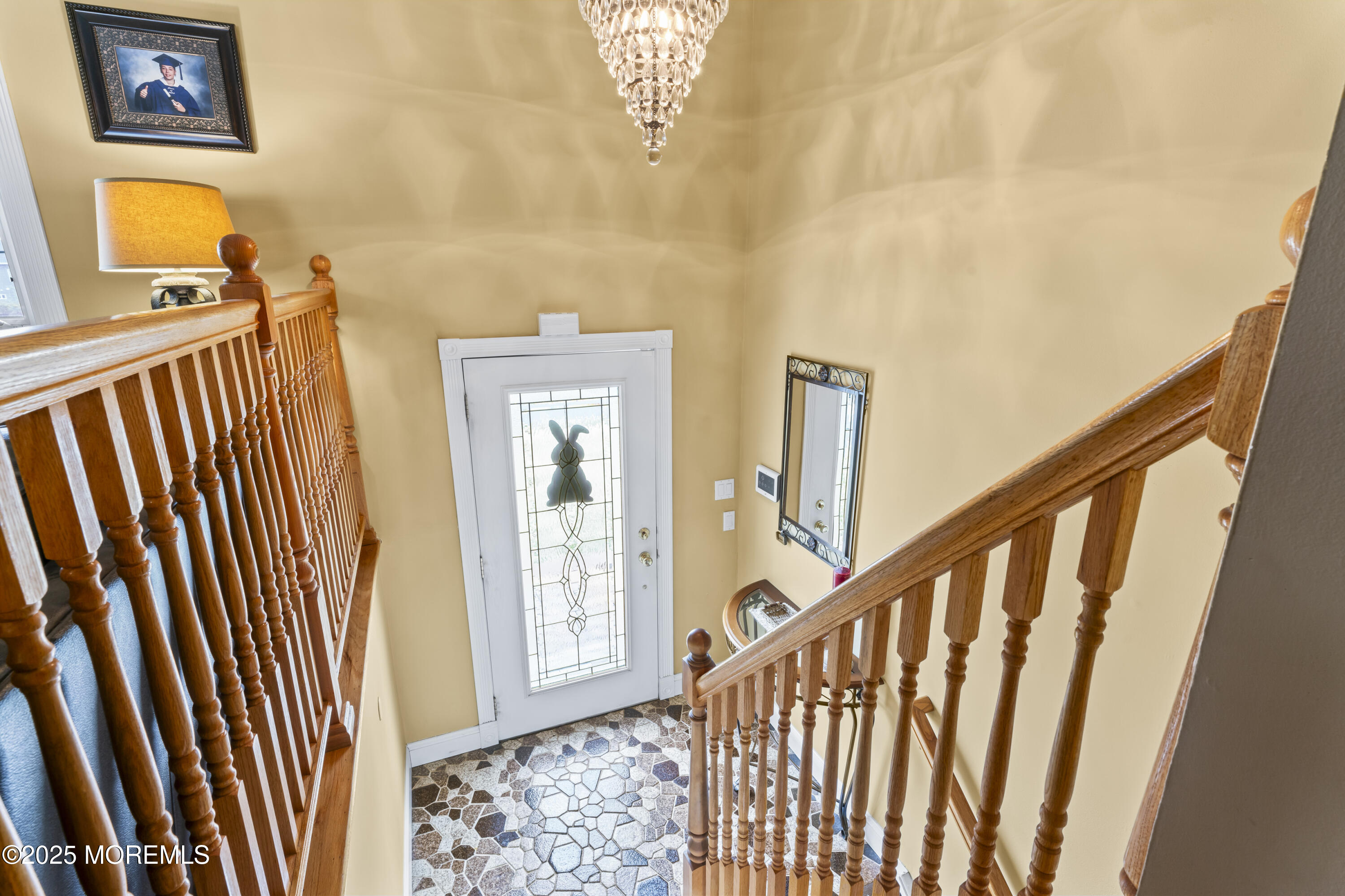 12 Nottingham Drive Howell, NJ 07731 - Photo 3 of 34 a view of a hallway with wooden floor and stairs