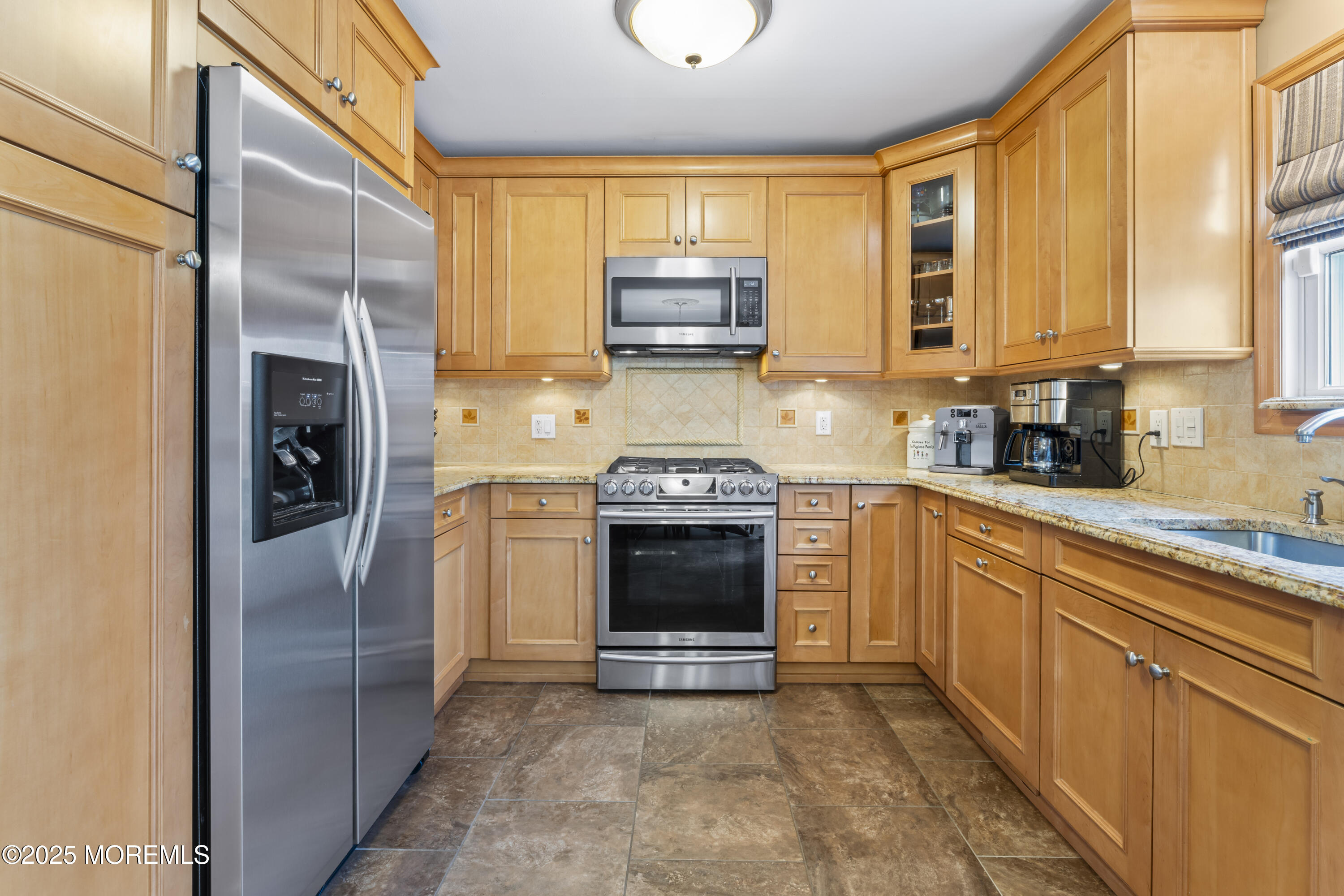 12 Nottingham Drive Howell, NJ 07731 - Photo 9 of 34 a kitchen with stainless steel appliances granite countertop a stove a refrigerator and a sink