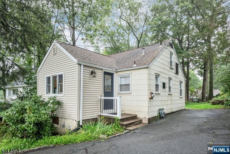 41 Bellot Road Ringwood, NJ 07456 - Photo 12 of 14 a view of a house with a yard and large tree