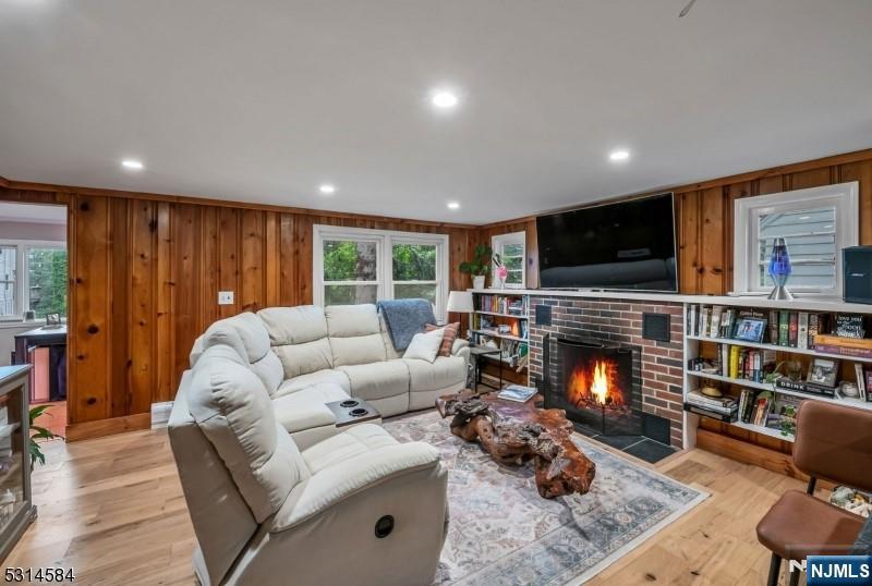 41 Bellot Road Ringwood, NJ 07456 - Photo 4 of 14 a living room with furniture and a fireplace
