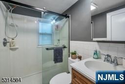 41 Bellot Road Ringwood, NJ 07456 - Photo 9 of 14 a bathroom with a sink toilet and shower