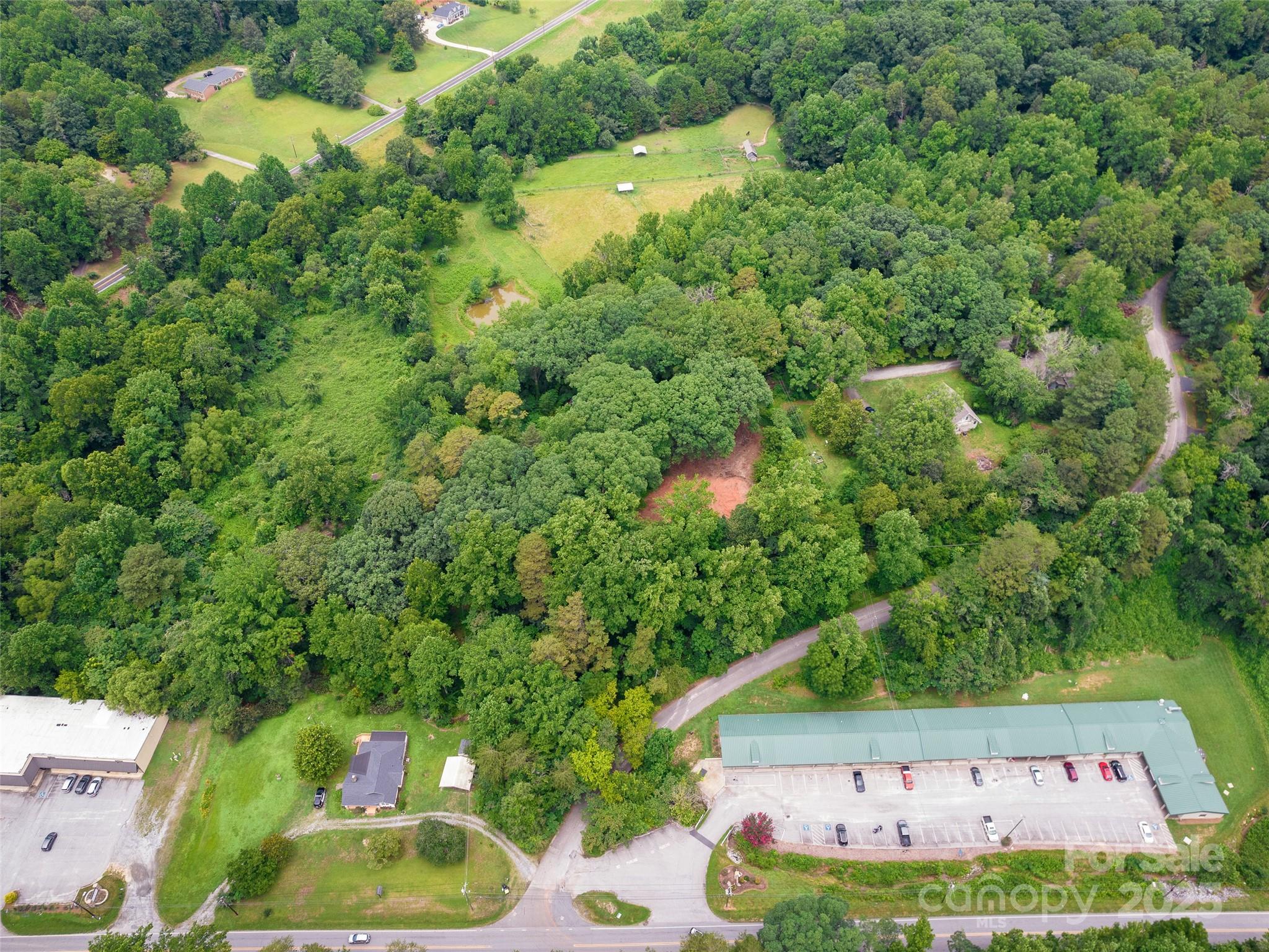 91 Ford Ridge Lane Columbus, NC 28722 - Photo 4 of 18 an aerial view of residential house with outdoor space and trees all around