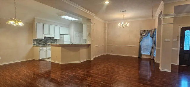 a view of a kitchen cabinets and wooden floor