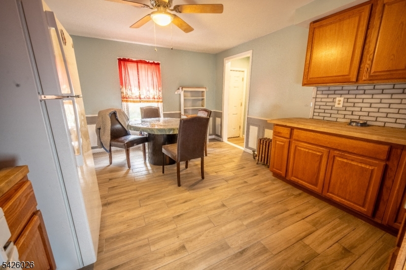 813 George Street Plainfield, NJ 07062 - Photo 2 of 10 a living room with stainless steel appliances furniture a rug and a large window