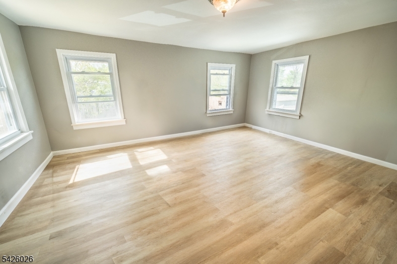 813 George Street Plainfield, NJ 07062 - Photo 5 of 10 a view of an empty room with a window
