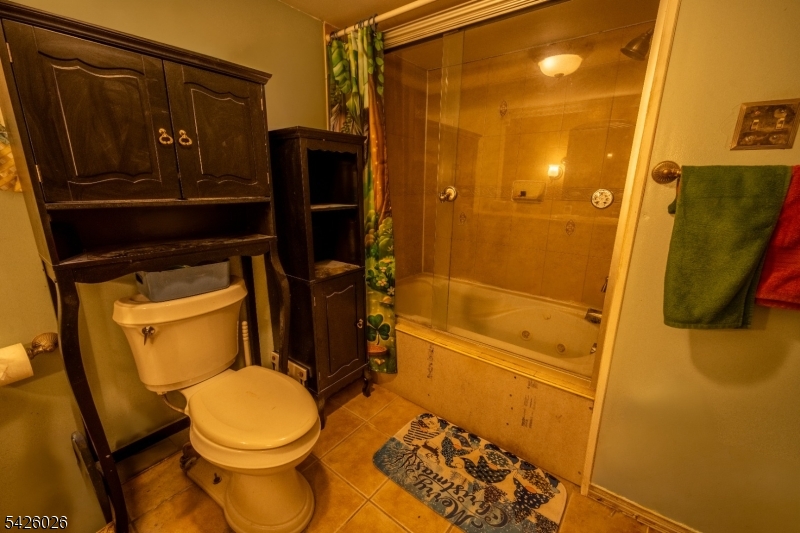 813 George Street Plainfield, NJ 07062 - Photo 8 of 10 a bathroom with a toilet and a shower