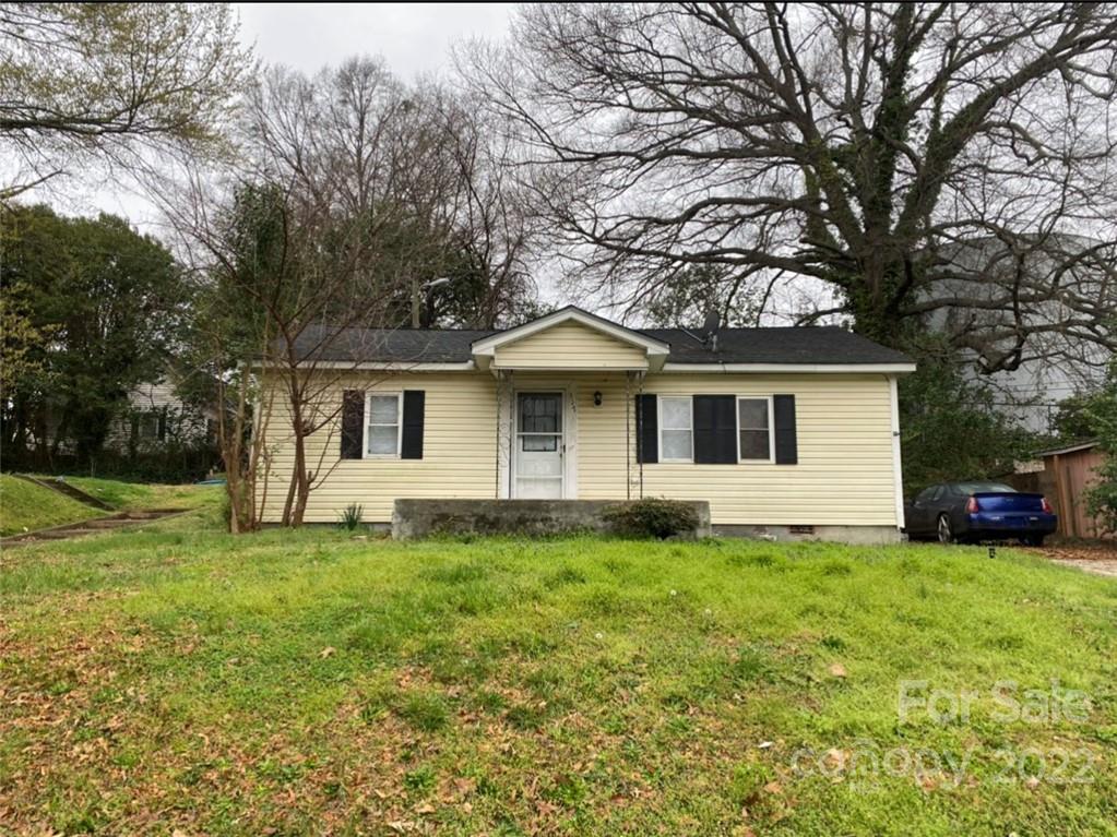 317 South Ransom Street Gastonia, NC 28052 - Photo 1 of 23 a front view of a house with a yard and trees