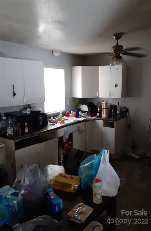 317 South Ransom Street Gastonia, NC 28052 - Photo 14 of 23 a kitchen with a sink and cabinets