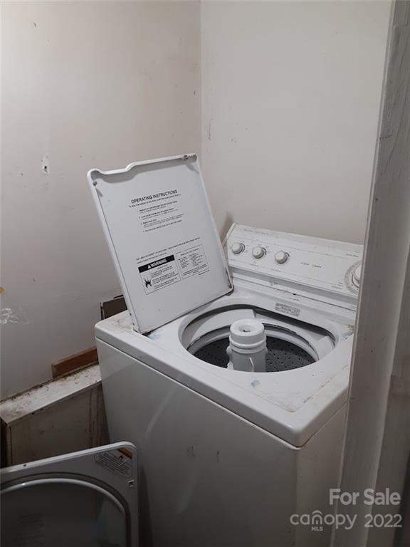 317 South Ransom Street Gastonia, NC 28052 - Photo 15 of 23 a view of storage and utility room with washer and dryer