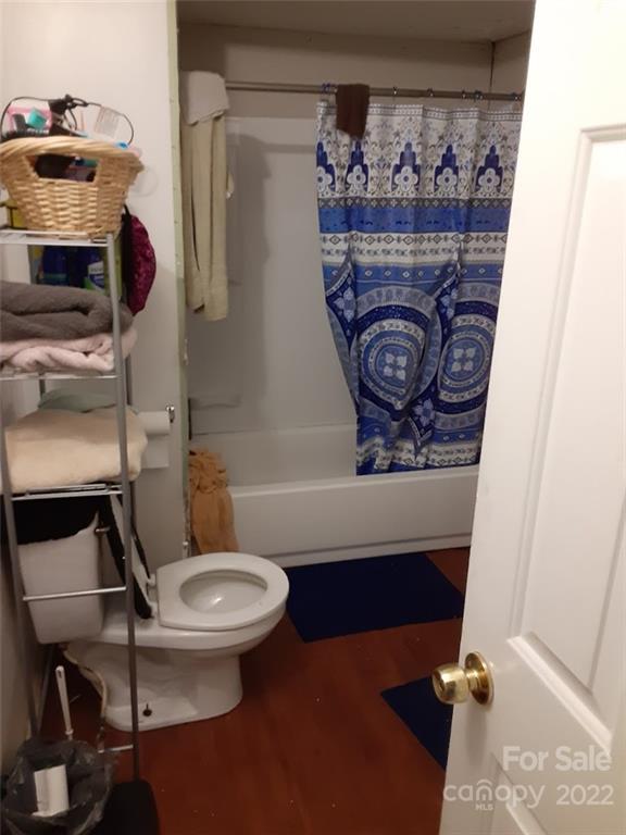 317 South Ransom Street Gastonia, NC 28052 - Photo 20 of 23 a bathroom with a toilet a sink and a mirror