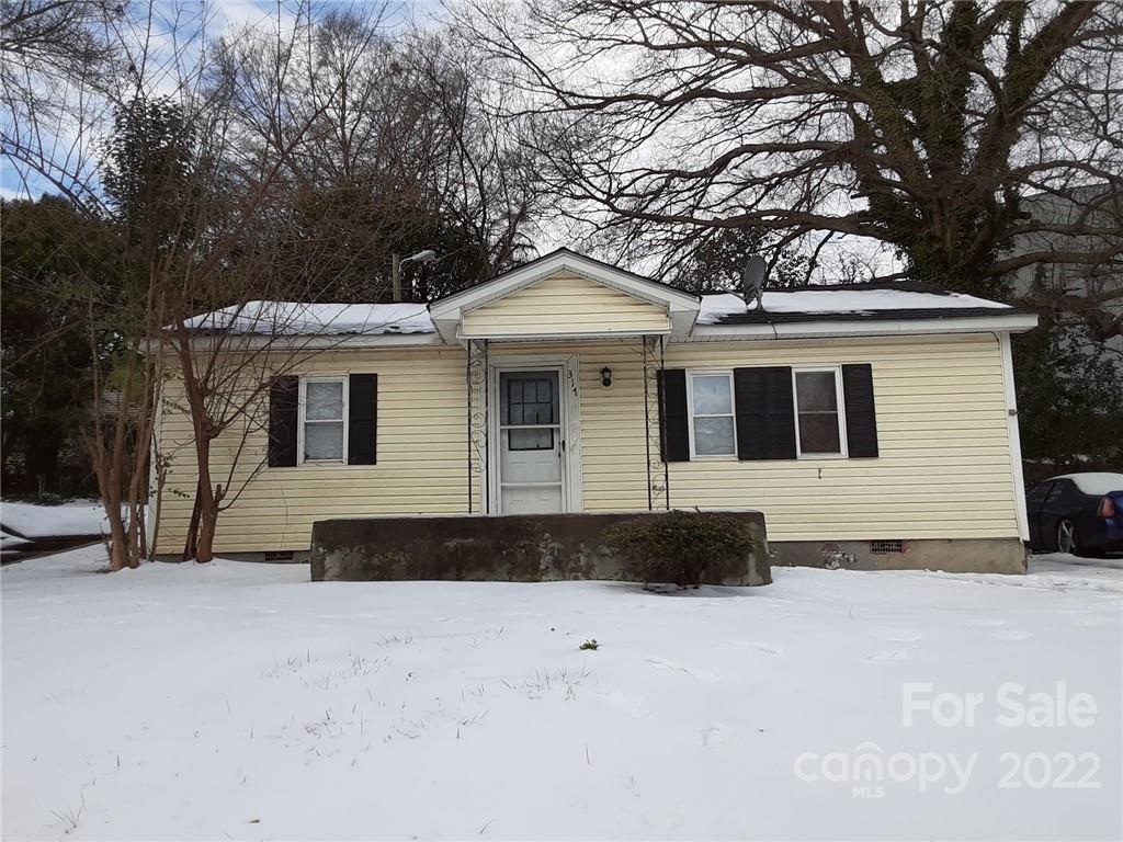 317 South Ransom Street Gastonia, NC 28052 - Photo 2 of 23 a front view of a house with a yard