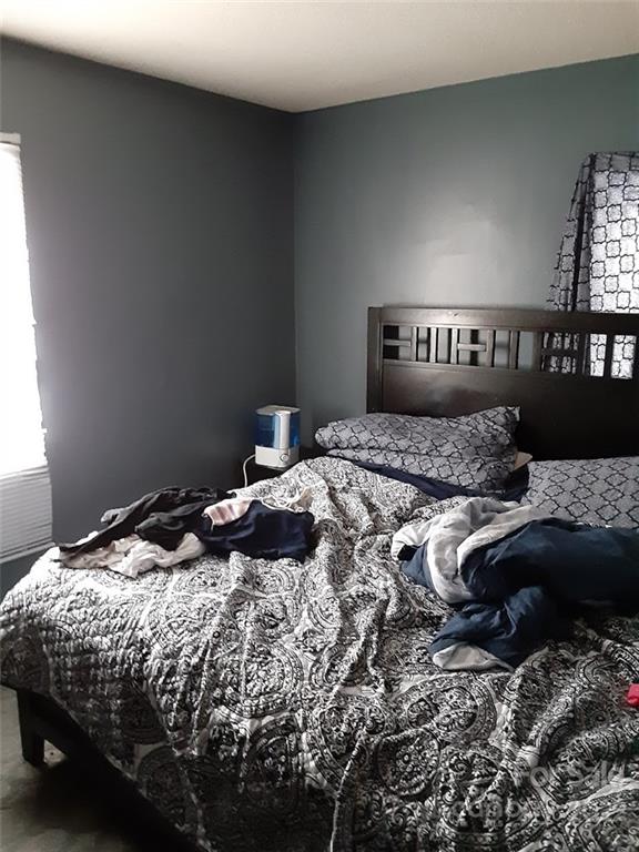 317 South Ransom Street Gastonia, NC 28052 - Photo 23 of 23 a bedroom with a bed and a night stand